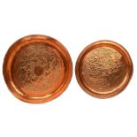 Two graduated Arts & Crafts circular hammered copper trays