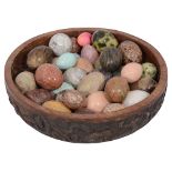 A collection of polished hardstone and mineral eggs