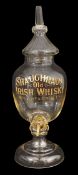 An Irish whisky glass advertising urn