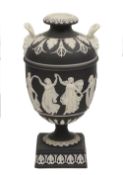 A 19th century black japserware twin handled urn