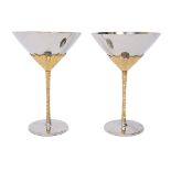 Stuart Devlin for Viners, a pair of stainless steel and gilt wine goblets