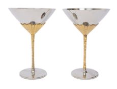 Stuart Devlin for Viners, a pair of stainless steel and gilt wine goblets