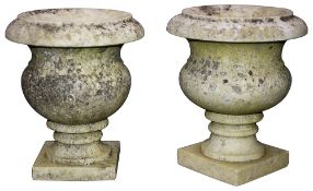 A pair of French marble urns