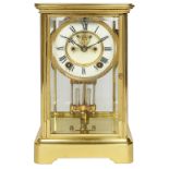 An early 20th century Ansonia lacquered brass four glass mantle clock