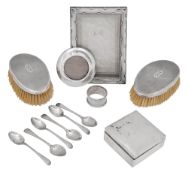 An Edwardian silver cigarette box, 2 brushes, 6 spoons, 2 frames (13)