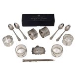 Assorted silver napkin rings and other silver
