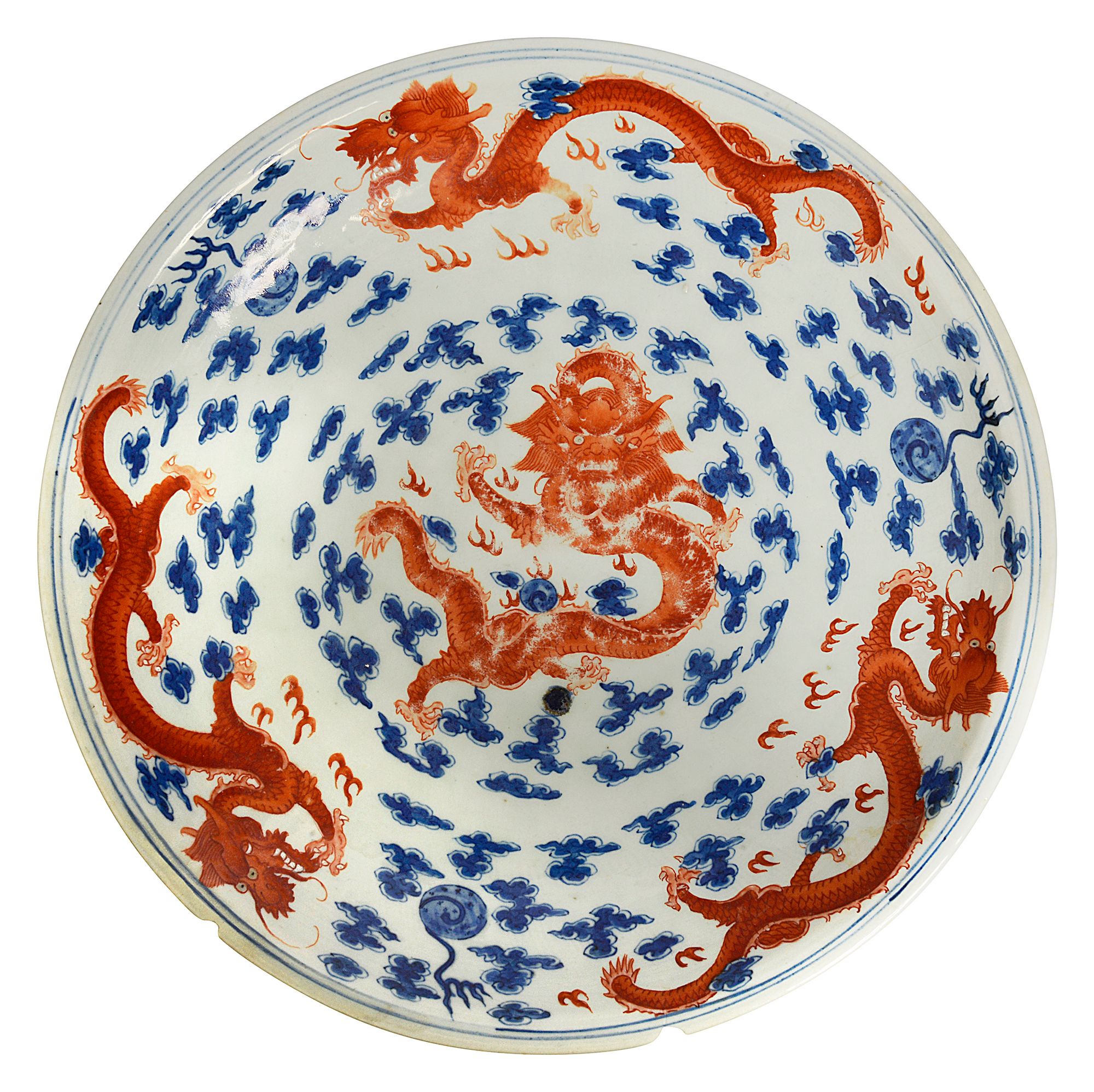 A Chinese blue, white and iron red porcelain dragon dish