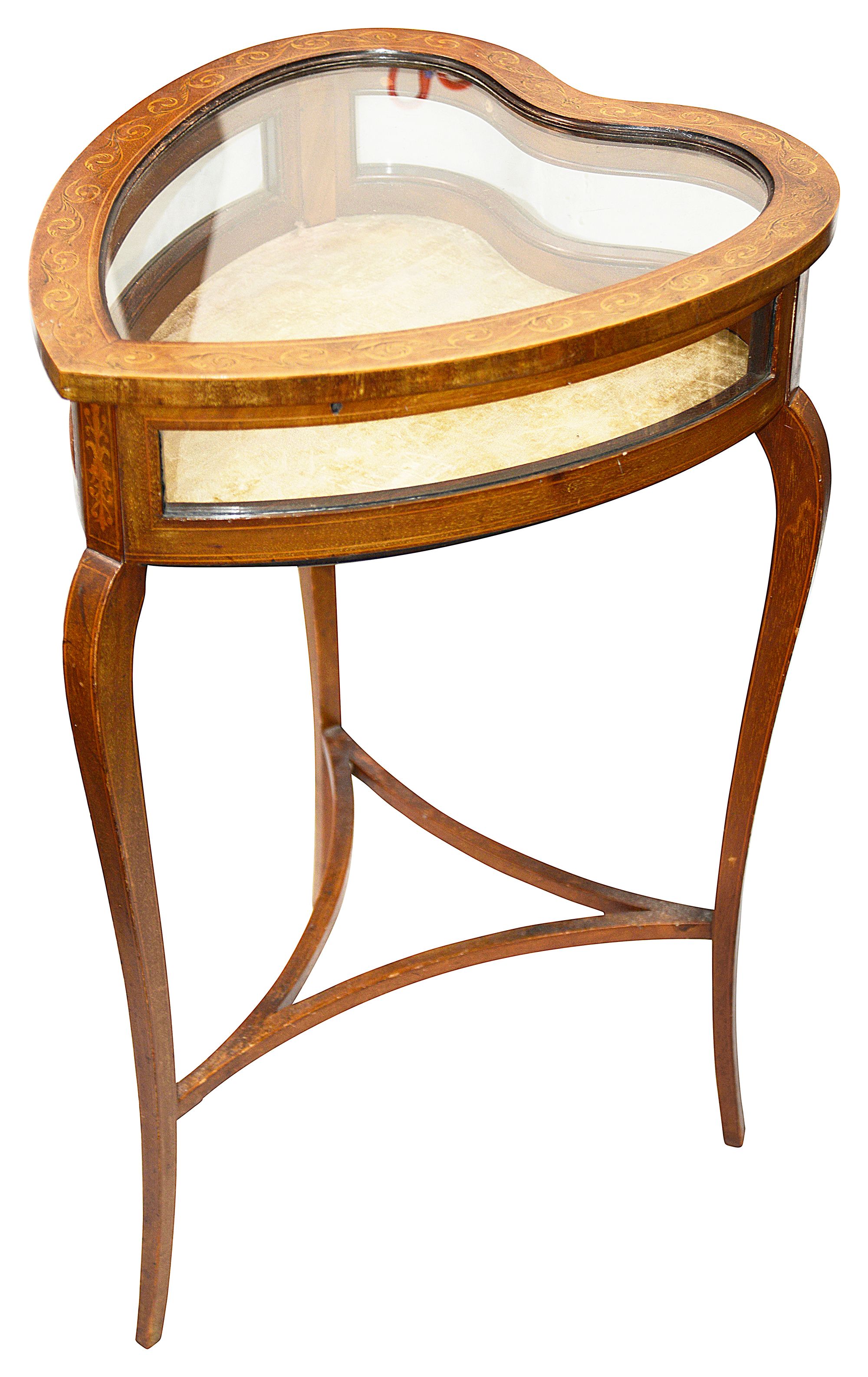 An Edwardian mahogany heart shaped bijouterie table