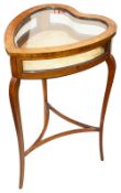 An Edwardian mahogany heart shaped bijouterie table