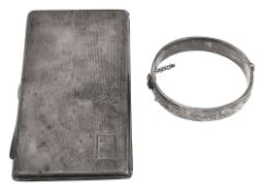 An Edward VIII Art Deco silver cigarette case and a hinged bangle