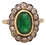 An emerald and diamond-set cluster ring