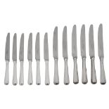 An set of twelve silver handled table and dessert knives