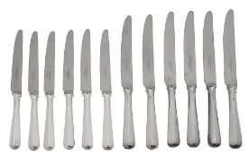 An set of twelve silver handled table and dessert knives