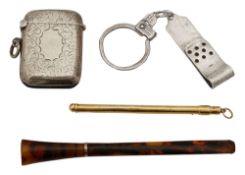 A champagne swizzle stick, a silver-gilt vesta case, other items
