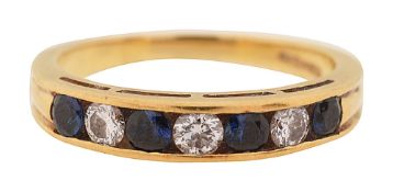 A sapphire and diamond half hoop eternity ring