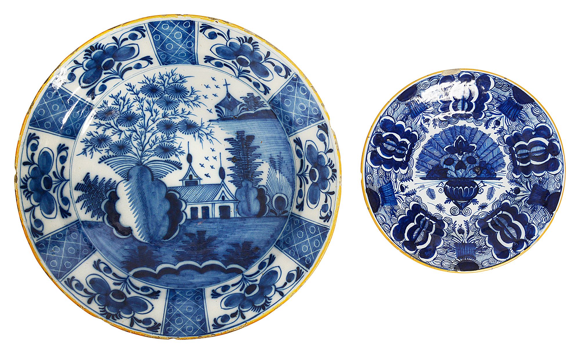 An Dutch Delft blue and white charger and a 'Peacock' plate