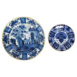 An Dutch Delft blue and white charger and a 'Peacock' plate