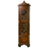 An Irish George III mahogany standing corner cupboard