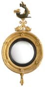 A Regency giltwood and gesso convex wall mirror