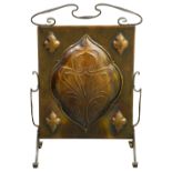 An Arts & Crafts wrought iron and copper firescreen