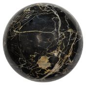 A large black polished Portoro marble sphere