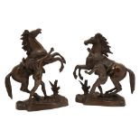 A pair of patinated bronze models of the 'Marley horses',