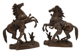 A pair of patinated bronze models of the 'Marley horses',