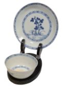 A Chinese export Nanking Cargo blue and white tea bowl and saucer