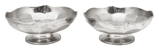 A pair of George V silver pedestal dishes