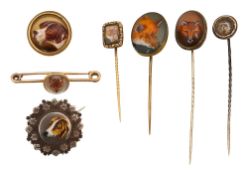 A group of stick pins and brooches of sporting interest