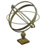 A pale green cast metal armillary sphere