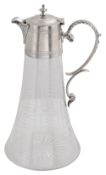 A late Victorian silver mounted engraved glass claret jug