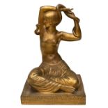 A bronze figure of the Snake Dancer