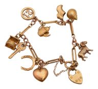 A fetter and three link 9ct gold charm bracelet