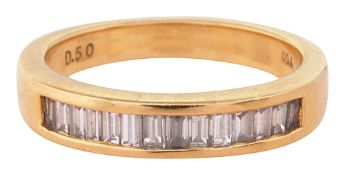 A baguette diamond-set half hoop eternity ring