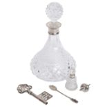 A modern silver mounted glass decanter and other items