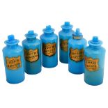 A set of six blue opaline glass apothecary bottle