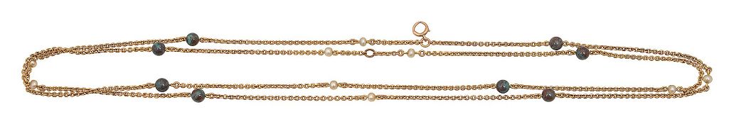 A yellow gold trace link long chain necklace