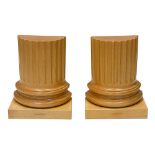 A pair of carved sycamore Greek part column bookends