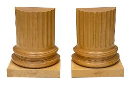 A pair of carved sycamore Greek part column bookends