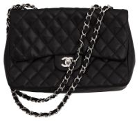 A black lambskin Chanel 2.55 flap bag