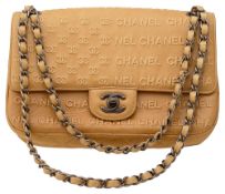 A Chanel beige calfskin flap bag