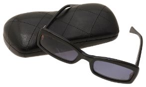 A pair of Chanel upside down sunglasses