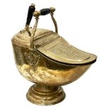 An Edwardian brass coal scuttle