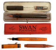 A Mabie Todd "Swan" Self Filling fountain pen and two other pens