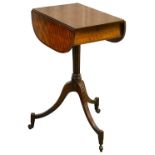 A small George III mahogany oval pedestal Pembroke table