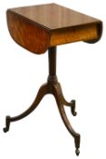 A small George III mahogany oval pedestal Pembroke table