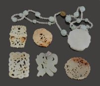 A Chinese mutton fat jade pendant necklace and five plaques