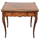 A French Louis XV style rosewood and marquetry games table