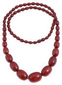 A Bakelite cherry coloured graduated bead necklace